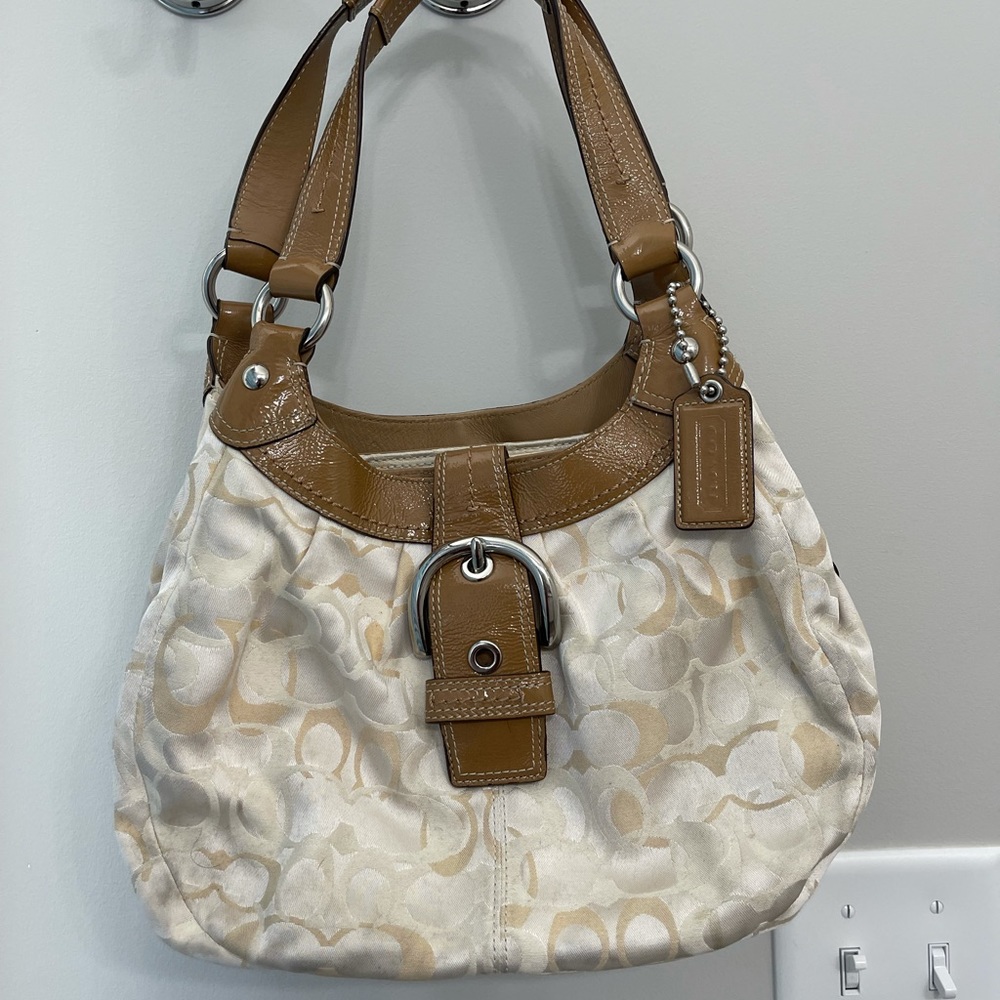White and gold Coach purse with Tan leather handle